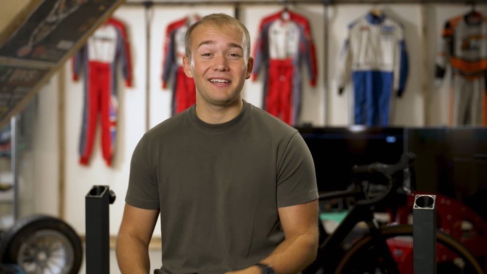 Billy Monger in his gym, up close and personal. Former British racing driver. TV commentator, celebrity, video garage image, blend and extend super-wide screen image for live event playback